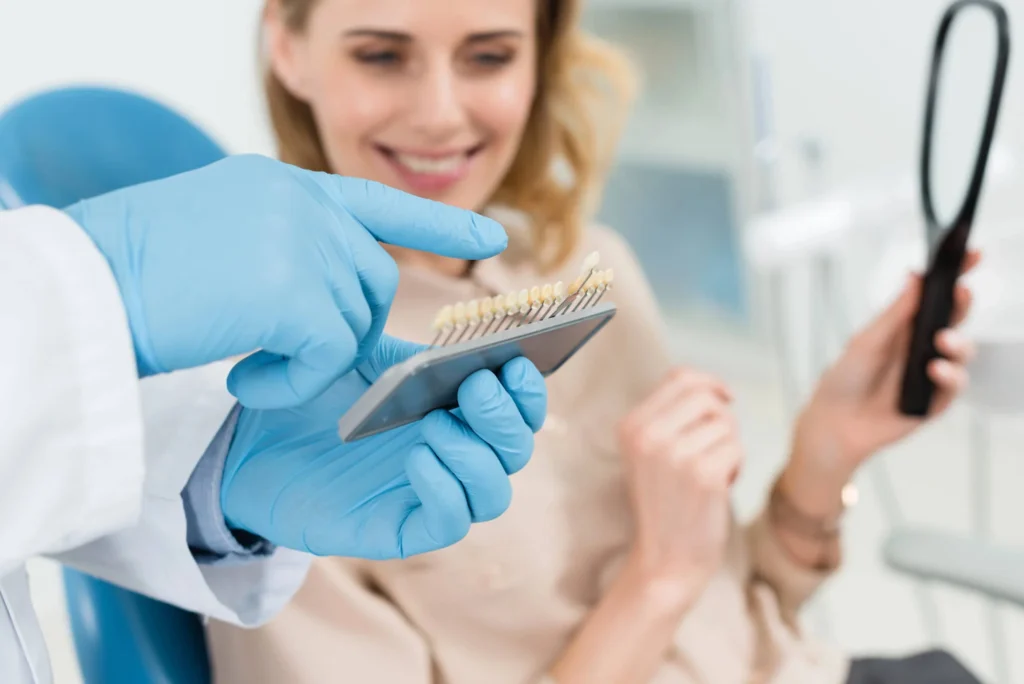 Doctor and female patient are choosing dental implants in Bethesda.