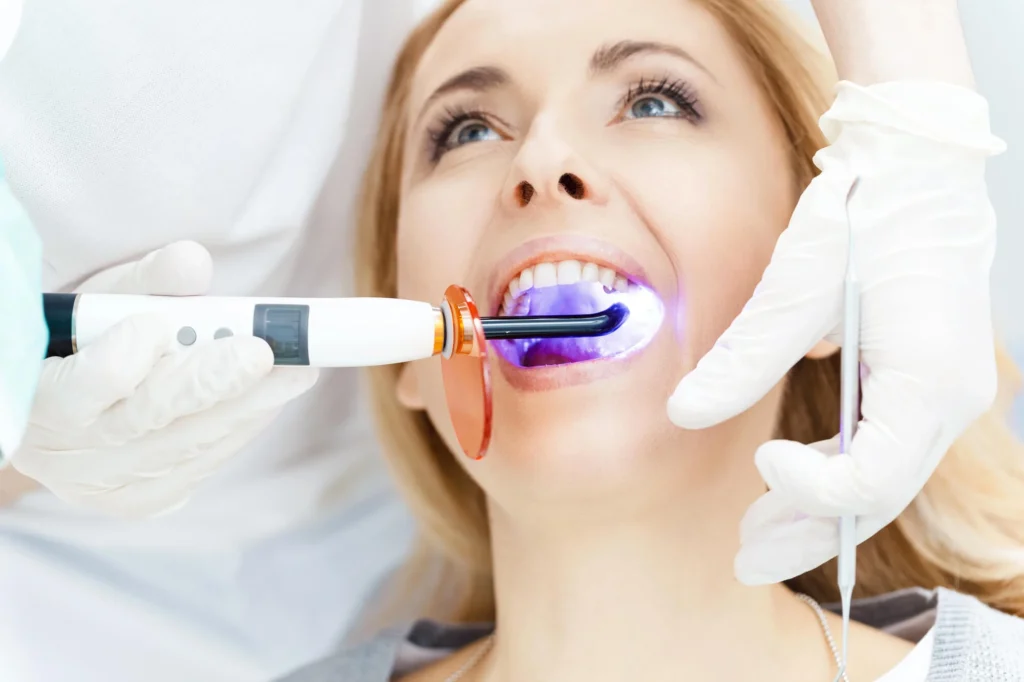 Female patient receiving cosmetic dentist services from unrecognized dentist in Bethesda, MD