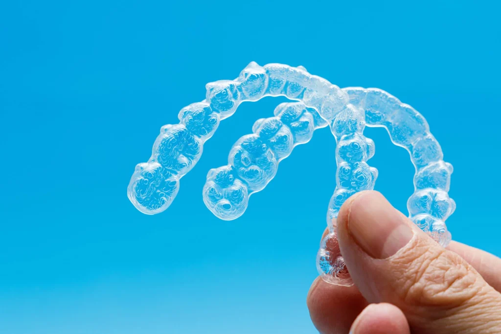 Invisalign in Bethesda, MD on a blue background.