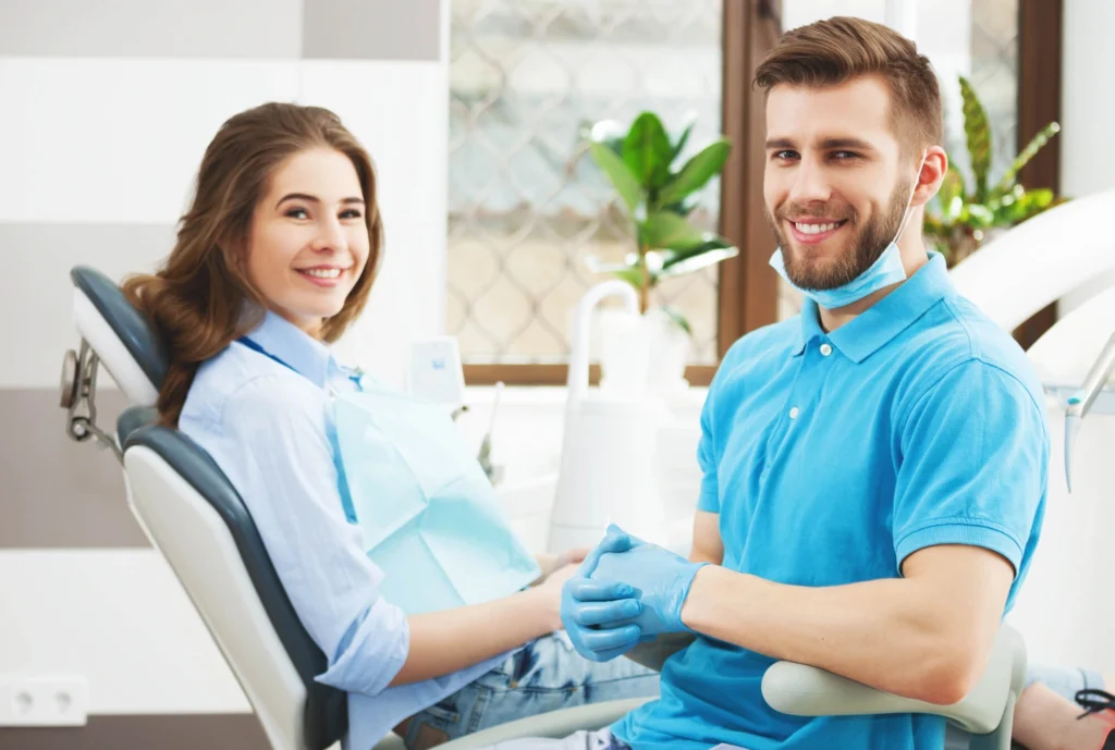 Portrait of a male and young happy female patient in a dentist near me