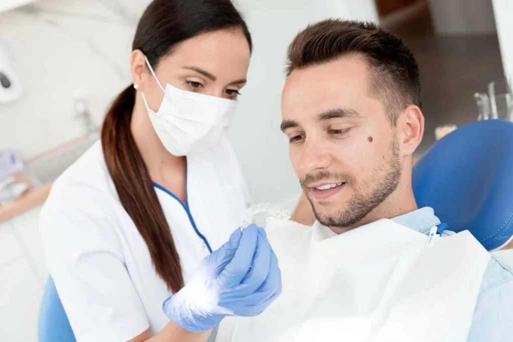 Dentist Showing Clear Aligners for Invisalign Bethesda MD